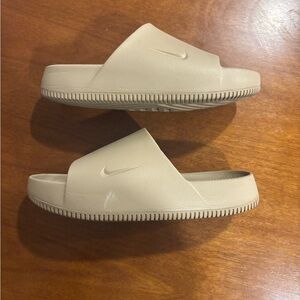Nike calm slides. Size men’s 10. Marks from normal wear.